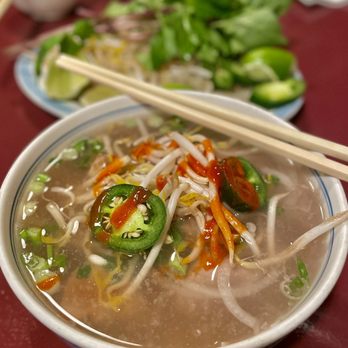 Pho Saigon - a bowl of soup with chopsticks - Vietnamese Near Me - Englewood, Colorado Pho Saigon - a bowl of soup with chopsticks - Vietnamese Near Me - Englewood, Colorado