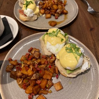Nineteen 61 - Bottom: Pollo Benedict Aji Verde. Top: Eggs Benedict - Latin American Near Me - Lakeland, Florida Nineteen 61 - Bottom: Pollo Benedict Aji Verde. Top: Eggs Benedict - Latin American Near Me - Lakeland, Florida