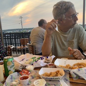 Seafood Sam's - Whole belly clams, native scallops & onion rings. - Seafood Near Me - Sandwich, Massachusetts Seafood Sam's - Whole belly clams, native scallops & onion rings. - Seafood Near Me - Sandwich, Massachusetts