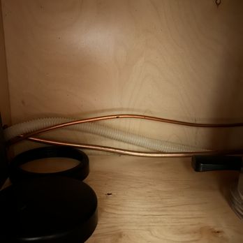 Fairfield Properties - Water pipe and wire for dish washer running through cabinets. - Apartments Near Me - Melville, New York