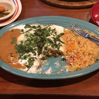 Los Tres Ranchitos - Anaheim Enchiladas. It's like a cross between a stuffed pepper and fajita chicken enchiladas covered in sour cream and cilantro - so good!! - Mexican Near Me - Tomball, Texas