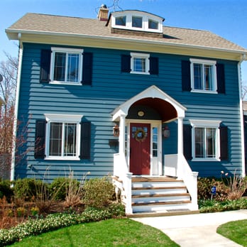 Siding & Windows Group - Glencoe House Remodeled by Siding & Windows Group, using James HardiePlank Siding in Evening Blue and HardieTrim in Arctic White - Windows Installation Near Me - Glenview, Illinois