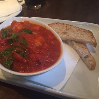 Prezzo - King prawns in a pomodoro sauce with garlic, red chilli and spinach. Served with toasted sourdough - Italian Near Me - London, XGL Prezzo - King prawns in a pomodoro sauce with garlic, red chilli and spinach. Served with toasted sourdough - Italian Near Me - London, XGL