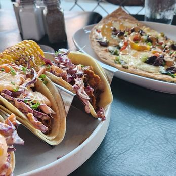 M's Pub - Korean BBQ tacos (left) and veggie Lahvosh (right). - New American Near Me - Omaha, Nebraska