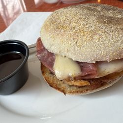 Arrow Coffee Company - Bodega breakfast sandwich - egg, cheese, salami on an english muffin + side of hot honey