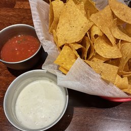 Complimentary chips + white sauce + salsa