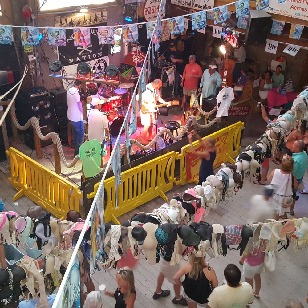 Flora-Bama Lounge, Package & Oyster Bar - Stage and dancefloor from the second level. - Music Venues Near Me - Pensacola, Florida Flora-Bama Lounge, Package & Oyster Bar - Stage and dancefloor from the second level. - Music Venues Near Me - Pensacola, Florida