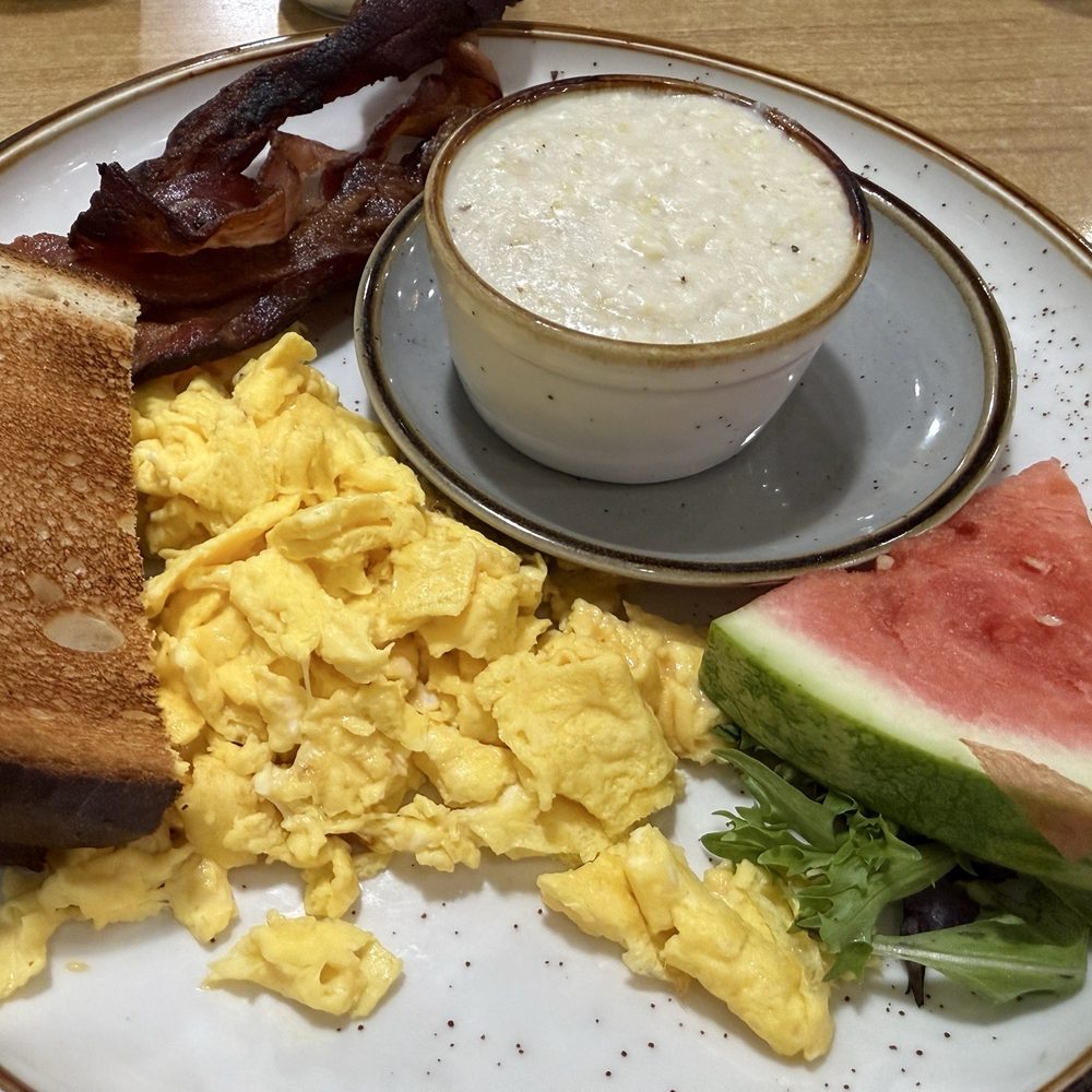 Eggcetera Breakfast & Lunch - The Village breakfast. Eggs, bacon, toast grits and a watermelon slice. - Breakfast & Brunch Near Me - Fort Myers, Florida Eggcetera Breakfast & Lunch - The Village breakfast. Eggs, bacon, toast grits and a watermelon slice. - Breakfast & Brunch Near Me - Fort Myers, Florida