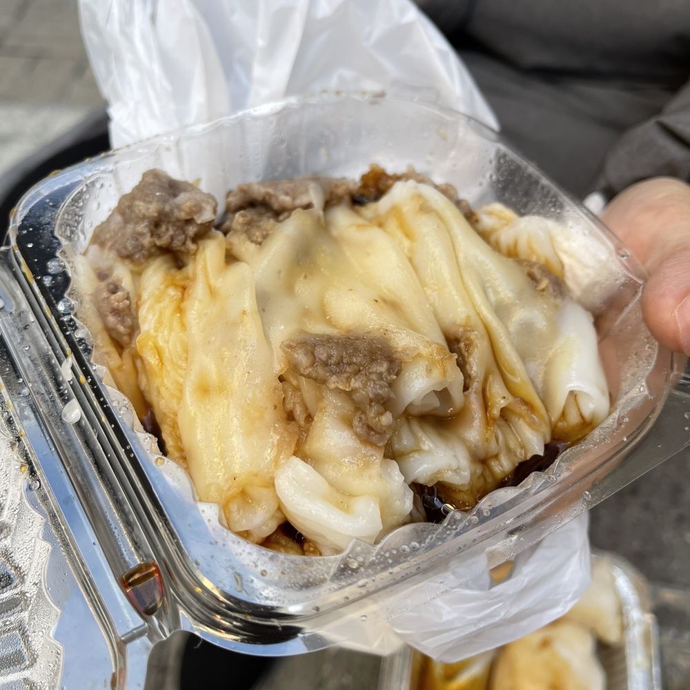 Fu Yuan - a person holding a container of food - Chinese Near Me - Flushing, New York Fu Yuan - a person holding a container of food - Chinese Near Me - Flushing, New York