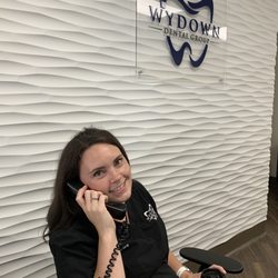 Wydown Dental Group - Dr. Sarah Spring helping patients by phone.