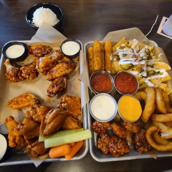 Buffalo Wild Wings - 15 bone wings spicy garlic and honey BBQ. And the sampler choice for our appetizer! - American Near Me - Honolulu, Hawaii Buffalo Wild Wings - 15 bone wings spicy garlic and honey BBQ. And the sampler choice for our appetizer! - American Near Me - Honolulu, Hawaii