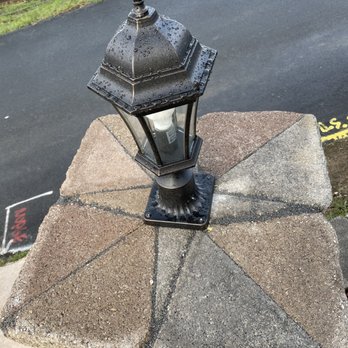 Oscar Landscaping - a black lantern on a stone block - Landscaping Near Me - Concord, California Oscar Landscaping - a black lantern on a stone block - Landscaping Near Me - Concord, California