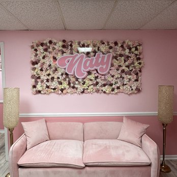 Naty Esthetics - Flower mural and couch - Waxing Near Me - Milwaukee, Wisconsin