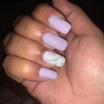 Modern Spa - UV gel. This was the finished product. Rough around the edges the shape of the nails aren't even. The marble design did come out real nice. - Nail Salons Near Me - New York, New York