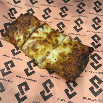 Pizza Collective - Burnt pizza slice. - Pizza Near Me - New York, New York Pizza Collective - Burnt pizza slice. - Pizza Near Me - New York, New York