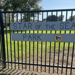 Star Of The Sea Park - Sign at entrance behind church