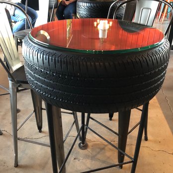 Golden Muse Winery - a table made out of a tire - Wine Tasting Room Near Me - Baroda, Michigan
