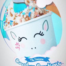 a cup of ice cream with a unicorn's face