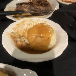 Mashed potatoes and T-bone steak