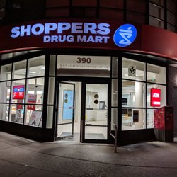Shoppers Drug Mart - Out front at night. June 2019