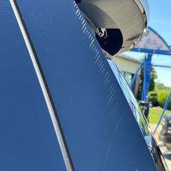 Coates Car Care Express - Side scratched all the way down.