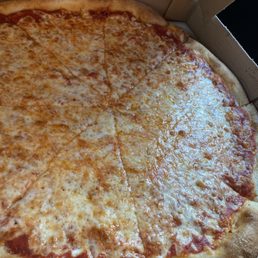 A cheese pizza from mikes up the street to show you how a pizza is suppose to look. A cheese pizza from mikes up the street to show you how a pizza is suppose to look.