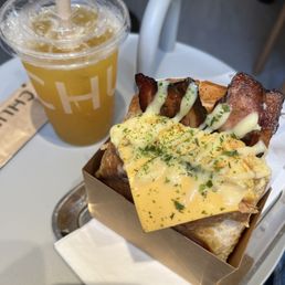 Bacon, Egg, and Cheese toast w a Mango Iced Tea