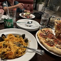 Seafood pasta and vegetarian pizza. Seafood pasta and vegetarian pizza.
