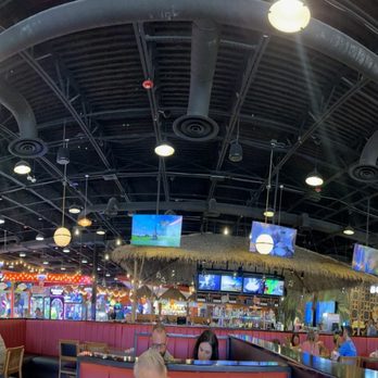 Downtown Flavortown - Dining room with bar and game room behind it. - Arcades Near Me - Pigeon Forge, Tennessee