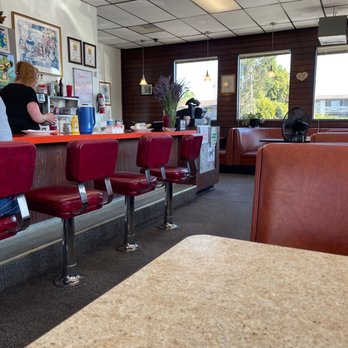 Starting Gate Restaurant - a woman sitting at the counter - Diners Near Me - Auburn, Washington Starting Gate Restaurant - a woman sitting at the counter - Diners Near Me - Auburn, Washington