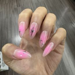 Gel X with pink airbrush and chrome stars Gel X with pink airbrush and chrome stars