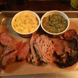 a platter of meat and sides