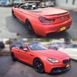 Sign Depot - 2015 BMW 650i convertible in Satin Red with matte blacked out front splitter, rims, rear diffuser, grill , and side skirts