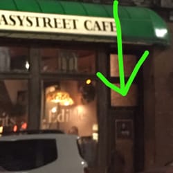 Grumpy Dave's Pub - Sorry it's so blurry. Took this from the car. The arrow is pointing to the door you enter to get up to Grumpy Dave's.