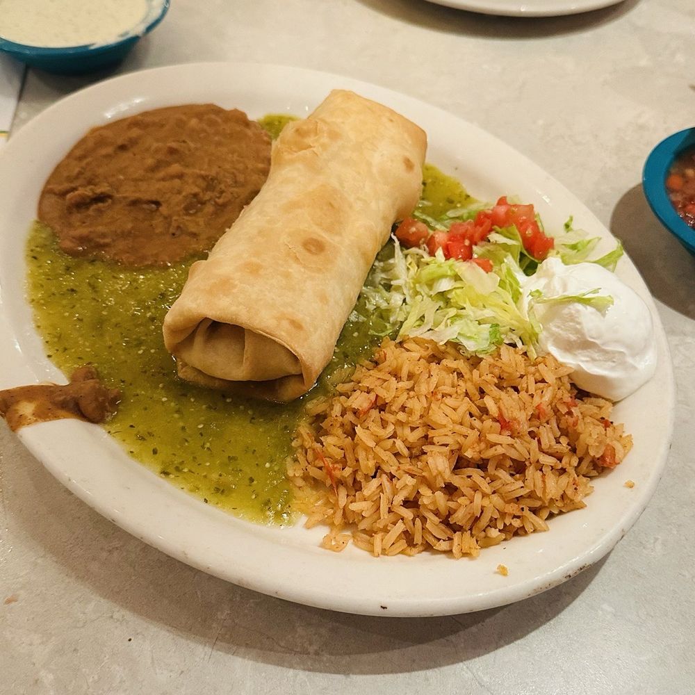 CHUYCHANGA. A flour tortilla filled with roasted chicken, cheese, cilantro & green chiles, deep fried.