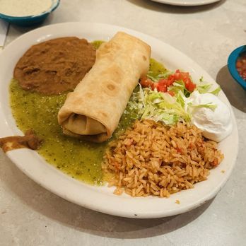 Chuy's - CHUYCHANGA. A flour tortilla filled with roasted chicken, cheese, cilantro & green chiles, deep fried. - Tex-Mex Near Me - Kissimmee, Florida