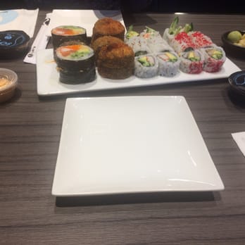 Sushi Shop - a plate of sushi and a bowl of dipping sauce - Sushi Bars Near Me - Châteauguay, Quebec Sushi Shop - a plate of sushi and a bowl of dipping sauce - Sushi Bars Near Me - Châteauguay, Quebec