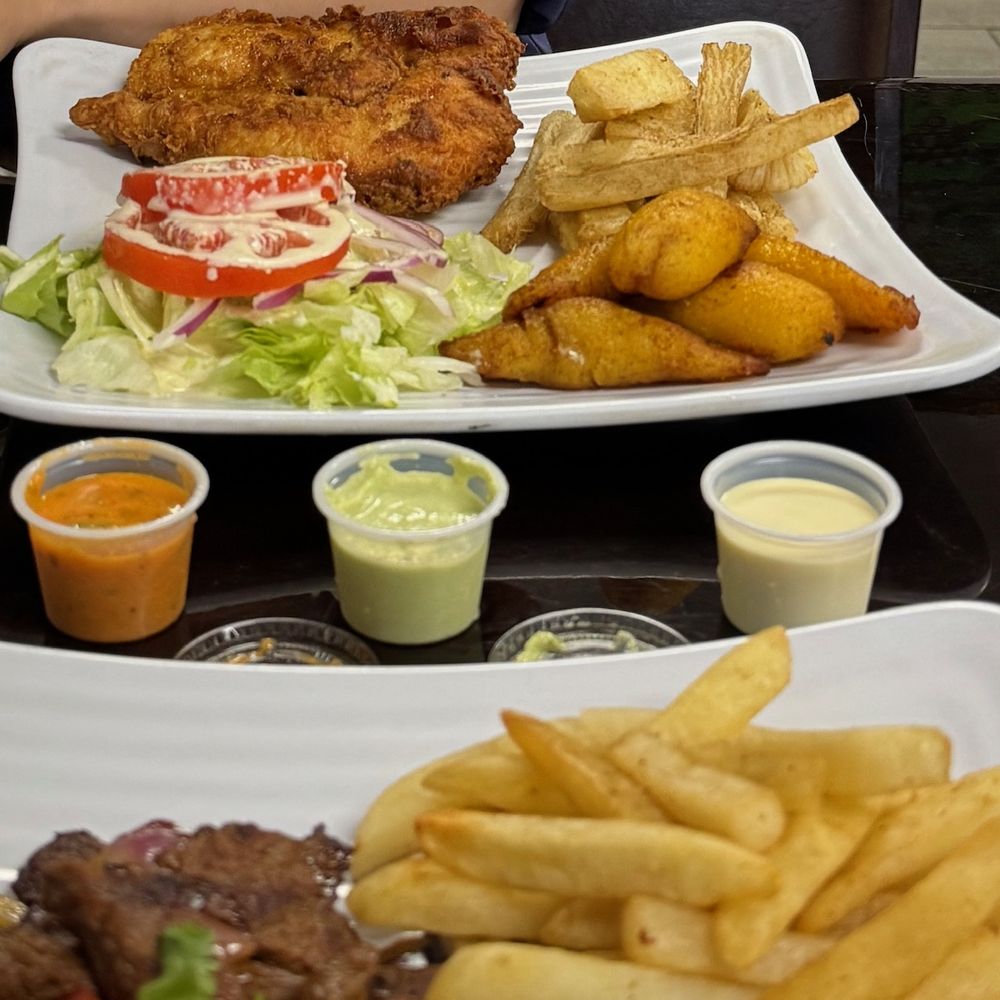 Broaster Chicken with salad, yuca, and platains Broaster Chicken with salad, yuca, and platains