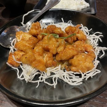P.F. Chang's - Crispy Honey Chicken on a bed of fried rice noodles. - Asian Fusion Near Me - Bakersfield, California P.F. Chang's - Crispy Honey Chicken on a bed of fried rice noodles. - Asian Fusion Near Me - Bakersfield, California