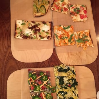 Jules Thin Crust - Each slice was cut in half before served to us. My family already started eating before I could snag this pic - Pizza Near Me - Princeton, New Jersey Jules Thin Crust - Each slice was cut in half before served to us. My family already started eating before I could snag this pic - Pizza Near Me - Princeton, New Jersey