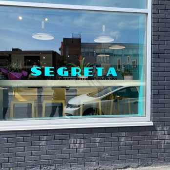 Segreta - the reflection of a car in the window - Pizza Near Me - Montreal, Quebec Segreta - the reflection of a car in the window - Pizza Near Me - Montreal, Quebec