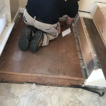 Roberts Hardwood Flooring Services - a man working on the floor - Flooring Near Me