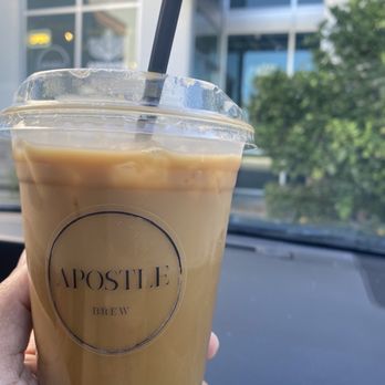 Apostle Brew - a hand holding a cup of iced coffee - Coffee Roasteries Near Me - Redlands, California Apostle Brew - a hand holding a cup of iced coffee - Coffee Roasteries Near Me - Redlands, California