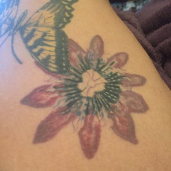 Liquid Dragon Tattoo Art Studio - He did NOT DO the butterfly. Travis did the shitty Passion flower that I have to get fixed - Piercing Near Me - Asheville, North Carolina