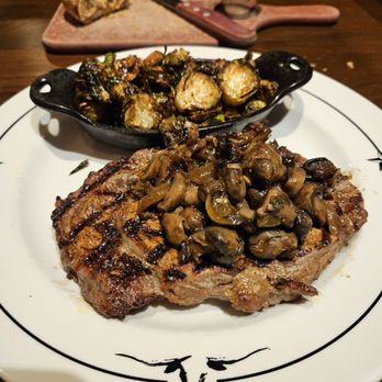 Saltgrass Steak House - 12 oz Ribeye smothered with sautéed mushrooms and onions with brussel sprouts - Steakhouses Near Me - Westminster, Colorado Saltgrass Steak House - 12 oz Ribeye smothered with sautéed mushrooms and onions with brussel sprouts - Steakhouses Near Me - Westminster, Colorado