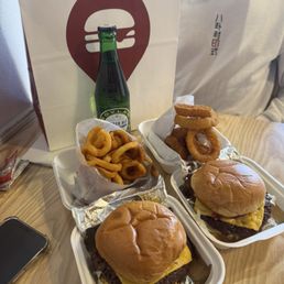 Classic burger, onion ring and curly fries
