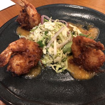 Tommy Bahama Restaurant - Appetizer: Coconut shrimp. 4 to an order. Delicious slaw with sweet tangy sauce - Cocktail Bars Near Me - Jupiter, Florida Tommy Bahama Restaurant - Appetizer: Coconut shrimp. 4 to an order. Delicious slaw with sweet tangy sauce - Cocktail Bars Near Me - Jupiter, Florida