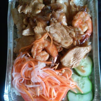Viet Thai Restaurant - The #27 Com Ga-Grilled chicken with rice, cucumbers, sliced tomatoes, pickled carrots (added shrimp for $2.00 more) and homemade fish sauce. - Vietnamese Near Me - Essex, Vermont Viet Thai Restaurant - The #27 Com Ga-Grilled chicken with rice, cucumbers, sliced tomatoes, pickled carrots (added shrimp for $2.00 more) and homemade fish sauce. - Vietnamese Near Me - Essex, Vermont
