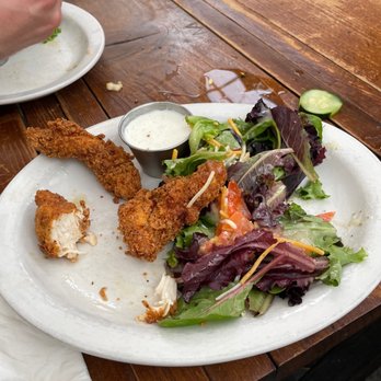 Space Room Lounge - a plate of food on a wooden table - Lounges Near Me - Portland, Oregon Space Room Lounge - a plate of food on a wooden table - Lounges Near Me - Portland, Oregon