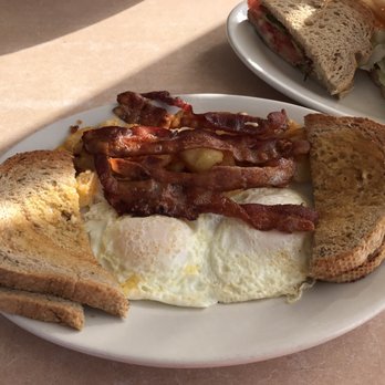 Ted's Luncheonette - 2 eggs over easy with home fries, bacon and rye toast - Breakfast & Brunch Near Me - Largo, Florida
